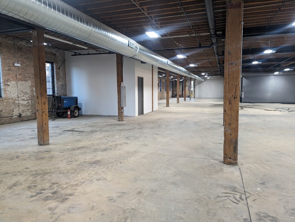 Completed warehouse interior with LED lighting and polished concrete floor