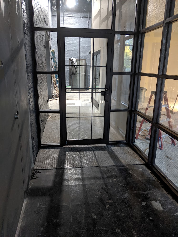 Commercial steel and glass entry door installation